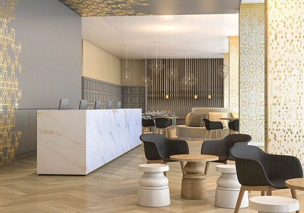 Modern lobby with sleek furniture and geometric wall designs.